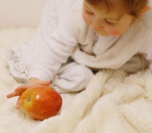 baby with apple