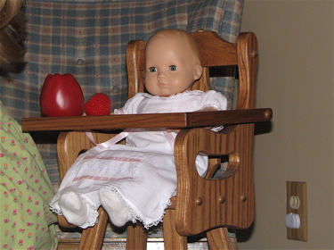 Baby Nora, her high chair and fruit